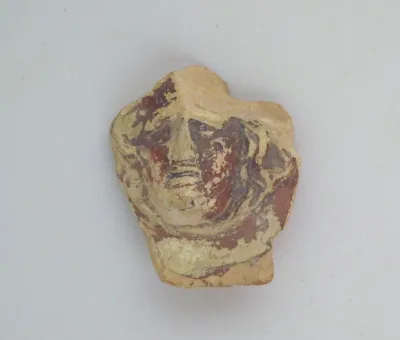 Vase fragment in the form of a face