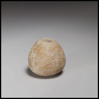 Terracotta conical-hemispherical spindle-whorl with rounded base