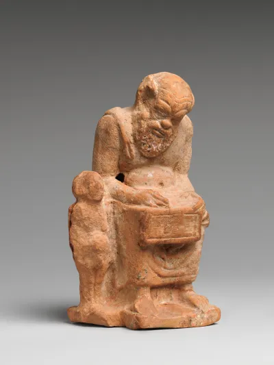 Terracotta statuette of a teacher and a pupil