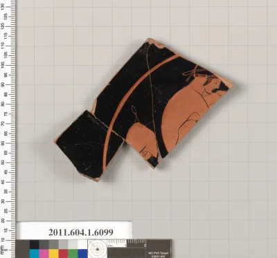 Terracotta fragment of a kylix (drinking cup)