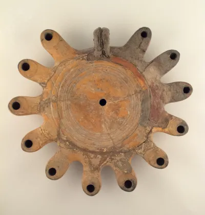 Terracotta lamp with multiple nozzles and ring handle
