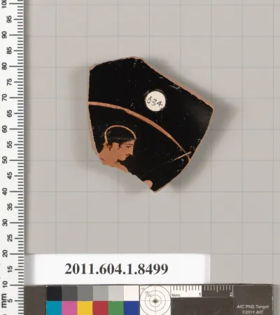 Terracotta fragment of a stemless kylix (drinking cup)