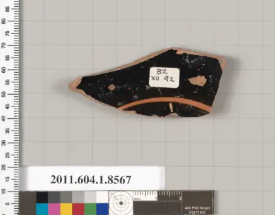 Terracotta fragment of a stemless kylix (drinking cup)