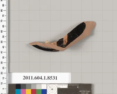 Terracotta fragment of a stemless kylix (drinking cup)