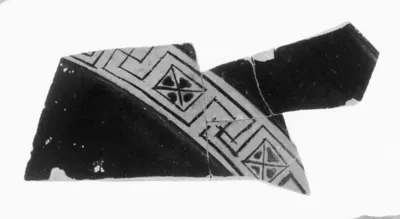 Fragment of an Attic Red-Figure Vase in the form of a Satyr holding a Keras (comprised of six joined fragments)