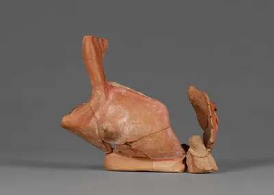 Fragment of an Attic Red-Figure Vase in the form of a Satyr holding a Keras (comprised of 13 joined fragments)
