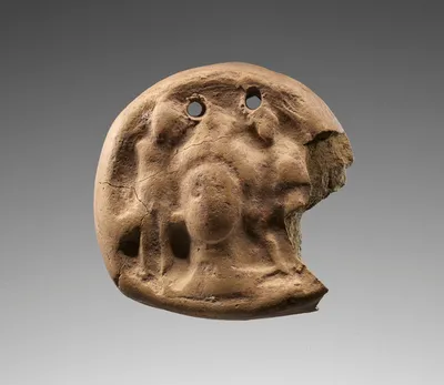 Loom Weight with Aphrodite and Two Children