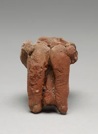 Fragmentary Neolithic seated male figurine