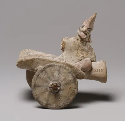 Model of a cart with a human figure