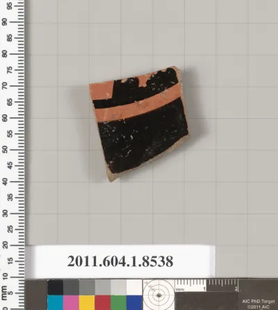 Terracotta fragment of a stemless kylix (drinking cup)