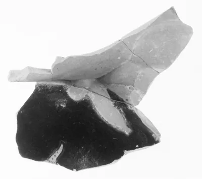 Fragment of an Attic Red-Figure Vase in the form of a Satyr holding a Keras (comprised of three joined fragments)