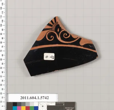 Terracotta fragment of a kylix: eye-cup  (drinking cup)