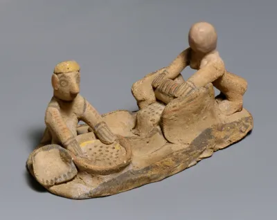 Terracotta group: making flour