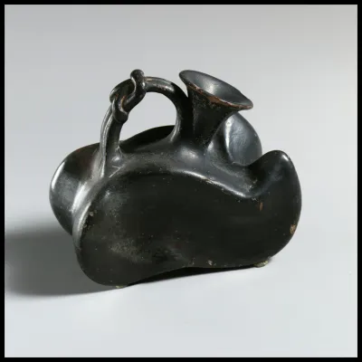 Terracotta askos (flask with a spout and handle over the top)