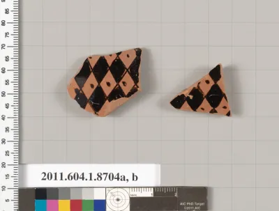 Terracotta fragments of a stemless kylix (drinking cup)