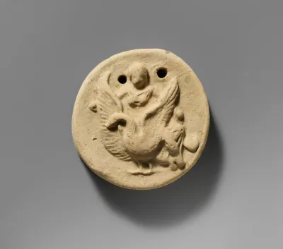 Terracotta disk with Aphrodite riding on a swan