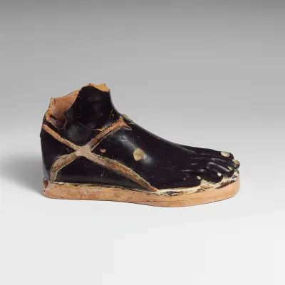 Terracotta vase in the shape of a sandaled right foot